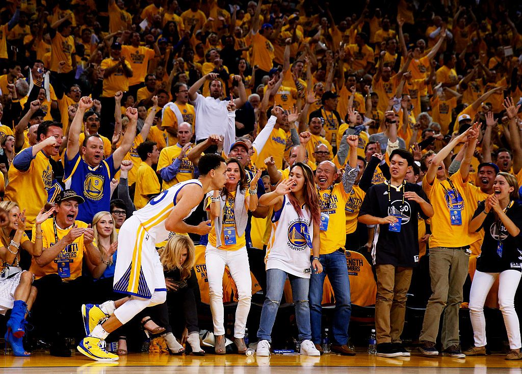 NBA fan cheering in an international basketball game arena