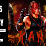 Kane in full mask and ring attire performing chokeslam, pyro erupting at WWE event